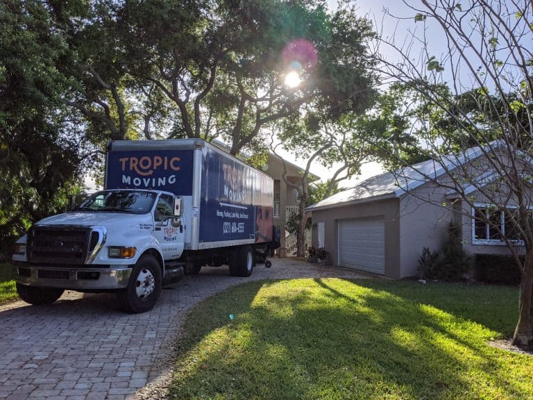 Tropic Moving Truck in Homes Driveway