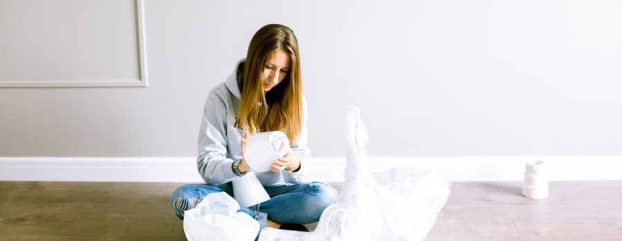 Woman Packing Fragile Items